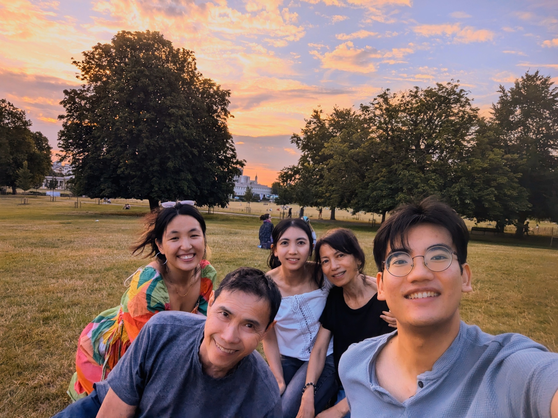 Mat and family in a park at sunset