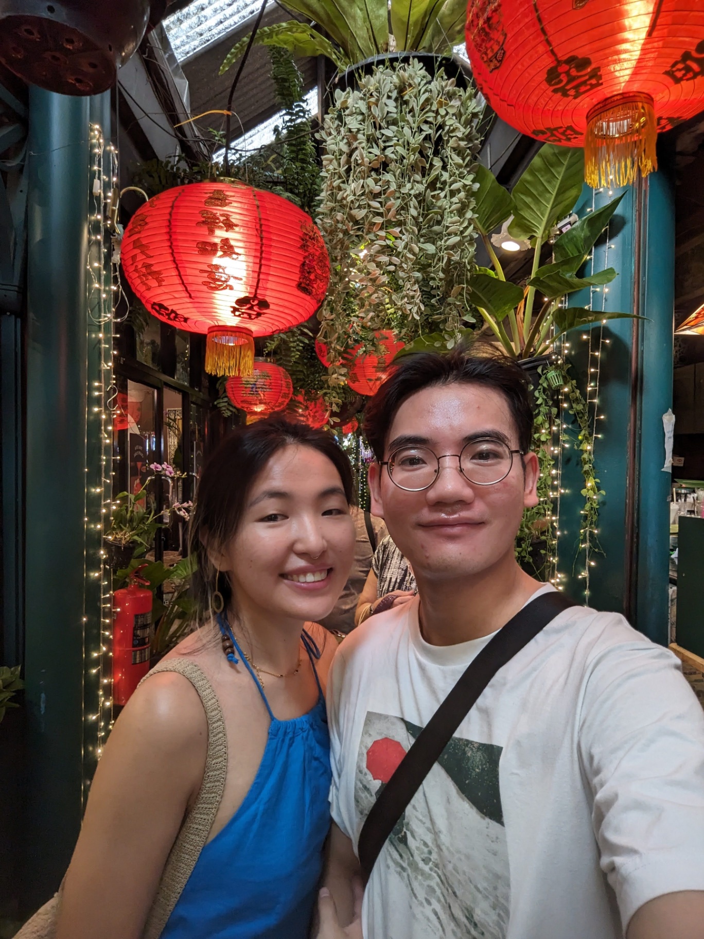 Mat and partner under red lanterns